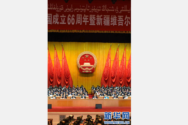 10月1日，慶祝中華人民共和國成立66周年暨新疆維吾爾自治區(qū)成立60周年大會在新疆人民會堂隆重舉行。 新華社記者 高潔 攝 